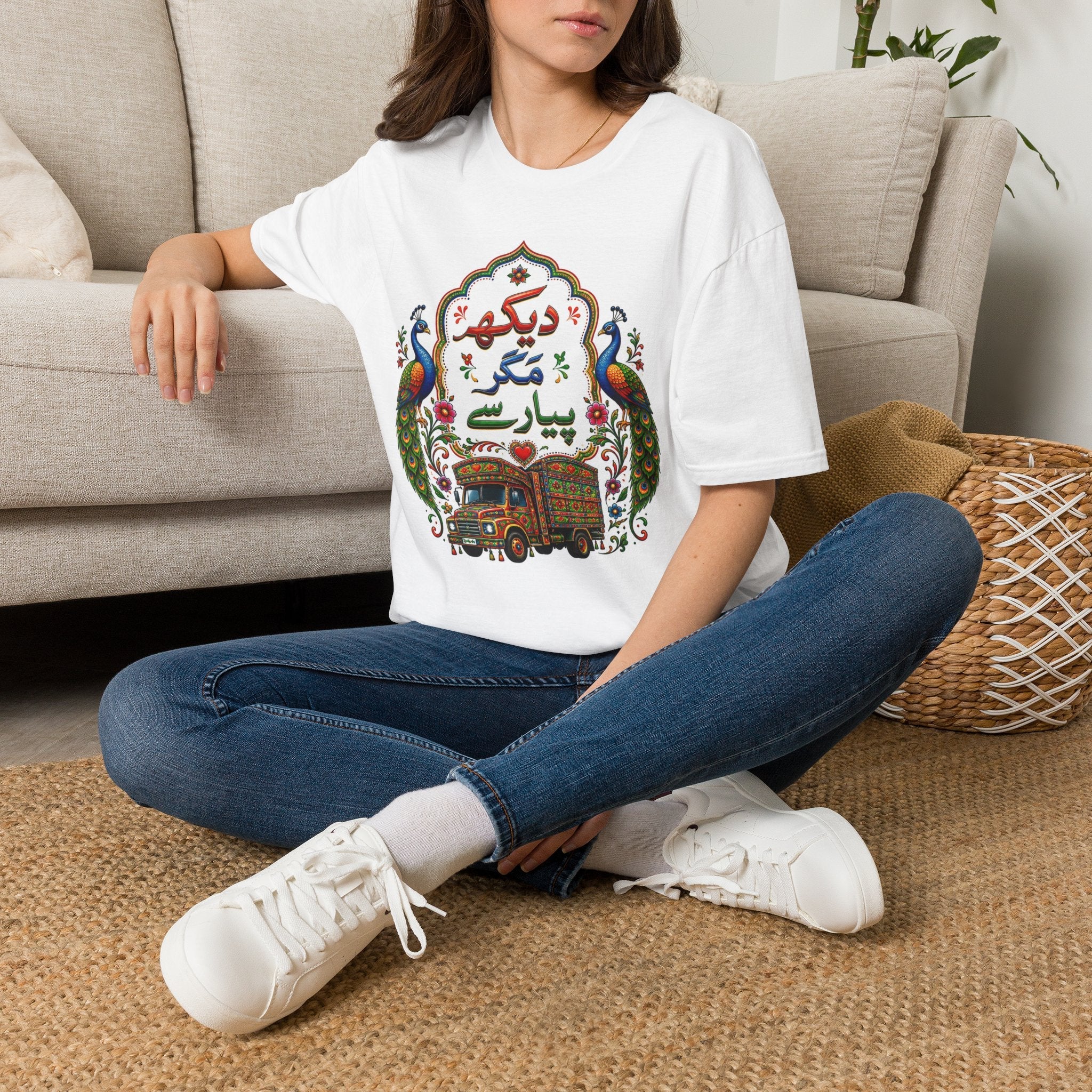 South Asian heritage graphic tee featuring hand-painted peacock and truck art motif